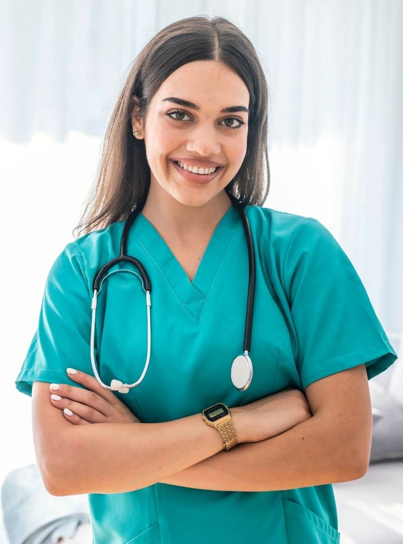 Nurse smiling with crossed arms